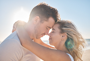 Image showing Beach hug, couple love and forehead touching of husband and wife on honeymoon vacation in Toronto Canada. Blue sky flare, freedom peace and marriage partnership bond of man and woman on romantic date