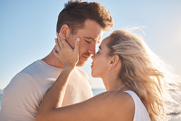 Image showing Love, couple and eyes closed on beach holiday, vacation or summer date outdoors. Romance, affection and man and woman ready for kiss, having fun on honeymoon and enjoying time together at seashore.