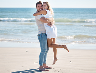 Image showing Hug, love and portrait of a couple on the beach on a summer vacation, adventure or journey. Happiness, smile and romantic man and woman embracing by the ocean while on a date on seaside holiday.