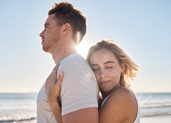 Image showing Love, couple and hug on beach holiday, vacation or summer date outdoors. Affection, romance and smile of man and woman on honeymoon, embrace and enjoying quality time together at seashore or coast.