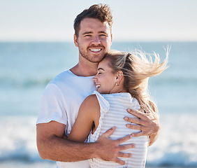 Image showing Couple, hug and beach in summer while on vacation for love, care and support in a healthy marriage with happiness and trust. Portrait of a man and woman together by the sea for bonding and to relax