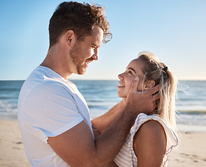 Image showing Couple, love and man and woman on a beach vacation for romantic relationship and travel date. Boyfriend, girlfriend and people being loving, caring and affection on a tropical holiday by the sea