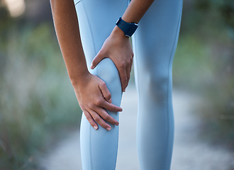 Image showing Knee pain, injury and sports accident of a woman hiking, running or doing exercise in nature. Medical emergency, muscle sprain and injured leg of an athlete outdoor trekking for a workout or training