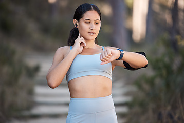 Image showing Fitness, exercise and woman with smartwatch to check pulse, progress and performance while outdoor for running and cardio training. Female with watch for time on sports app during training in nature