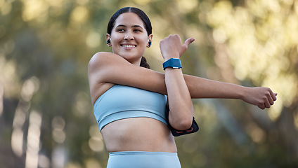 Image showing Stretching, thinking and woman training in nature with music on earpods for motivation, mindset and health. Fitness, idea and athlete with podcast warm up before cardio, workout or pilates in a park