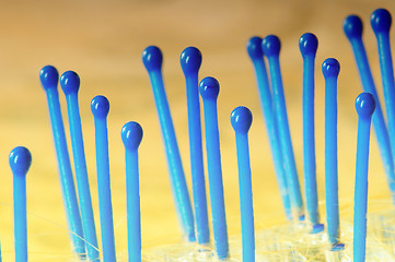 Image showing Blue Hairbrush on Gold