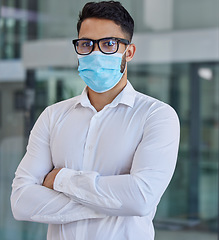 Image showing Businessman, mask and glasses with arms crossed in covid vision for health, safety and protection at office. Portrait of confident employee man in healthcare management during pandemic at workplace