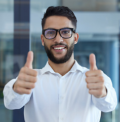 Image showing Portrait, thumbs up and thank you with a business man standing in his office as a winner saying yes. Portrait, trust and success with a male employee in agreement of a deal, goal or success
