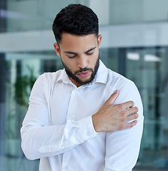 Image showing Shoulder pain, injury or accident of a businessman in the office with stress, frustrated and burnout. Medical emergency, muscle sprain or injured arm of a professional male employee at the workplace.