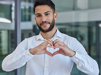 Image showing Business man, heart emoji and smile of CEO, boss or leader for charity, support and thank you sign in office with happiness and pride. Portrait of entrepreneur happy about growth, trust and kindness