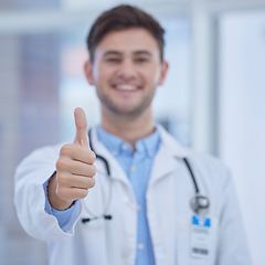 Image showing Portrait, doctor and thumbs up in hospital for success, welcome and thank you. Trust, support or medical worker with hand sign or gesture for approval, agreement or yes for healthcare in clinic alone