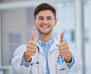 Image showing Healthcare, thumbs up and portrait of doctor in hospital with hand sign for good news, agreement and success. Medical care, thank you and health worker standing in clinic for trust, support and care