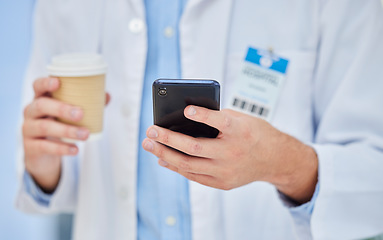 Image showing Doctor, coffee break and cup, smartphone technology and mobile app, reading notification and connection in hospital. Healthcare worker hands, drinking coffee and using phone, telehealth and contact