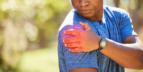 Image showing Hand, shoulder and pain with a sports black man holding his joint after injury during his fitness or exercise. Health, medical and anatomy with a male athlete suffering damage highlighted by CGI