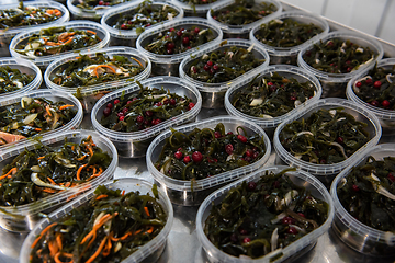 Image showing Different fish and chuka wakame laminaria seaweed salad