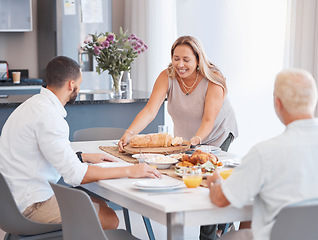 Image showing Happy family, thanksgiving or bonding with healthy food on dining table in house or home for holiday party. Smile, happy or mature woman with festive or buffet lunch meal for men in celebration