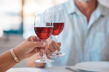 Image showing Hands, wine glasses and cheers for celebration dinner, date or table in thanks for fine dining at home. Hand of couple toasting with wine for relationship, romance and clinking glass for dating love