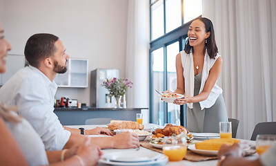 Image showing Family, friends and woman serving lunch for celebration of Christmas, birthday or weekend time. Happy family, men and women smile at table eating and drinking together at dinner with home cooking.