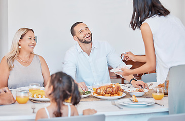 Image showing Happy family, bonding and thanksgiving meal at dining table in house, home or restaurant for holiday celebration. Smile, happy or festive man, women and children with traditional healthy food serving