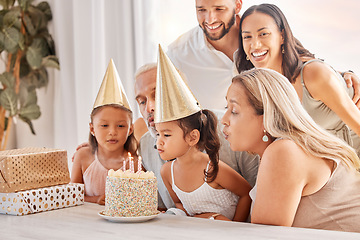 Image showing Family, kids and birthday cake with a child and her big family celebrating with a party for fun event. Generations, mother and father with grandparents and grandkids celebrate with dessert or candles