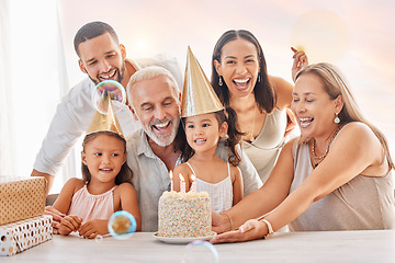 Image showing Birthday, party and family with a girl, parents and grandparents in celebration together in their home. Cake, hat and gift with children celebrating a milestone during a happy event in a house