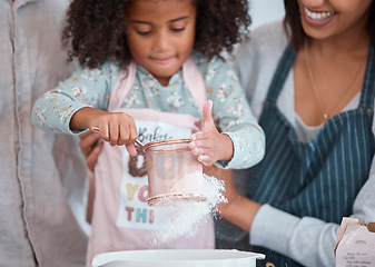 Image showing Hands, children and baking with a girl learning how to bake in the kitchen of her home with mother. Flour, kids and cooking with a female child and parent teaching about ingredients for a recipe