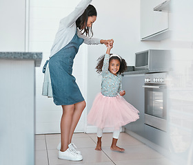 Image showing Dancing, playful and mother and child with freedom, music and happy in the kitchen of their house. Crazy, comic and girl dancer teaching her mom to dance with love and smile in their family home