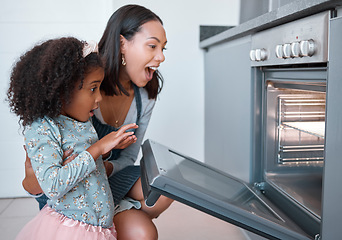 Image showing Kitchen, mom and girl excited with baking in oven, checking results, working together and learning to bake family recipe. Child development, happy home cooking and bonding time for woman and child