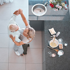 Image showing Top view, bonding couple or dancing in kitchen of house or home and baking ingredients on countertop for breakfast food, cake or pastry dessert. Middle aged man or happy woman in waltz dance for love