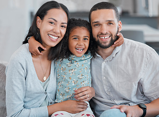 Image showing Girl, mother and happy father, portrait and relax on sofa, love and care with smile in family home together. Family, parents and child hug, happiness and laugh with support on couch in family home