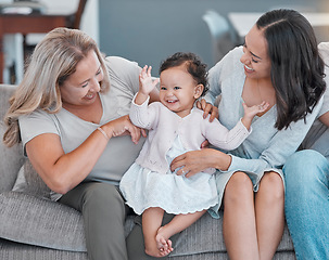 Image showing Family home, love and baby, mother and grandmother with happiness on living room couch for love, care and fun while excited, happy and dancing. Generation of women on the sofa for support and pride