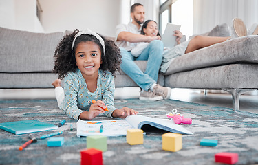 Image showing Child, girl or kid drawing in book and relax parents on digital tablet in house or family home living room. Portrait, smile or happy learning and playing on floor with color and mom and father online