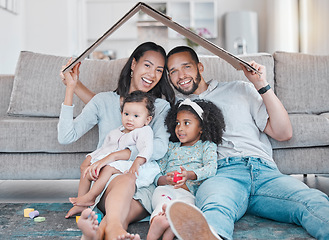 Image showing Happy family, new house and cardboard roof in living room, mortgage loan and investment security for future. Real estate, insurance and property cover for new homeowners, excited parents and children