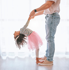 Image showing Happy, bonding and father teaching child to dance on feet with support holding hands in their house. Help, ballerina and dancing girl learning a move with her dad in the living room of family home