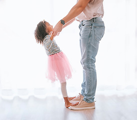 Image showing Father, child and dance in ballet tutu for fun, bonding and artistic expression with love and care in childhood. Dancer, dancing and man with daughter having fun in the family home being playful