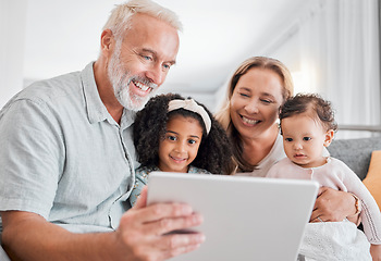 Image showing Family, tablet and online browsing with senior people babysitting grandchildren in the family home. Grandfather, grandmother and grandkids with a digital tablet for streaming internet media