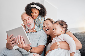 Image showing Family selfie, tablet and social media, picture and happy smile with grandparents and girl children on sofa in home. Senior man, woman and kids funny face, fun and enjoying bonding in family home