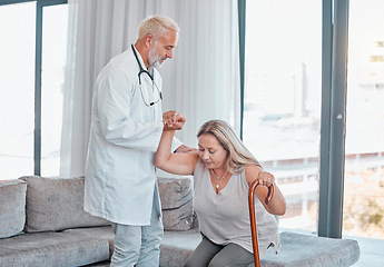 Image showing Helping hand, doctor and woman with cane in home visit, physiotherapy or rehabilitation. Disability, physical therapy and female with walking stick and medical physician offer aid to get up in house