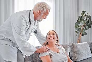 Image showing Healthcare, support and doctor with patient in home doing checkup, consultation and health exam. Medical care, trust and healthcare worker with woman on sofa smiling for care, compassion and empathy