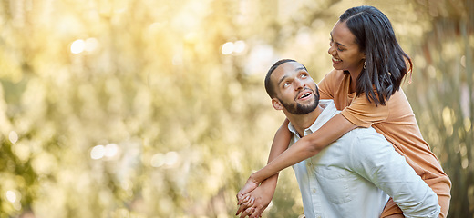 Image showing Happy, piggy back and couple on date in nature with love, care and happiness in green garden. Relationship, bond and man and woman with smile for quality time with romance together with mockup space.