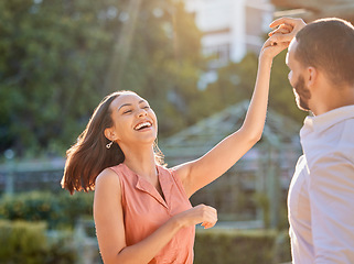 Image showing Couple, happy and dance outdoor for love, care and support or relationship bonding together. Woman, dancing celebration with man and quality time or comic romance, happiness and smile in park