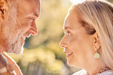 Image showing Mature, couple and face for bonding, love and care romantic relationship in a summer garden. Old man and woman in love in retirement for bond, caring and honeymoon affection in a park in spring