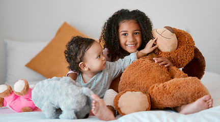 Image showing Children, baby girl and siblings bonding with teddy bear on house, family home or orphanage bed and support, security or comfort trust toy. Smile, happy and playful kids with stuffed animal in foster