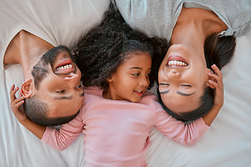 Image showing Top view, love and parents with child in bed bonding, smiling and enjoy morning together. Family, happiness and aerial of young girl in bedroom for quality time, affection and relax with mom and dad