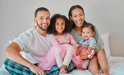 Image showing Family, portrait and bedroom relax for bonding, love and care with girl children on the home bed. Mother, father and sisters or siblings bond with parents in loving relationship in childhood