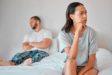 Image showing Couple, fight or divorce for angry woman on bed in house, home or hotel bedroom in cheating affair, scandal or argument. Frustrated, mad or annoyed wife and man in stress, burnout or marriage crisis