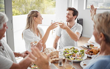 Image showing Family brunch, happy celebration toast and group of people excited, cheer and celebrate couple marriage announcement. Love, wine food and good news for man, woman and parents bonding at lunch buffet