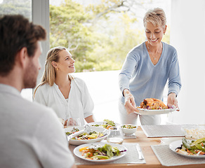 Image showing family, relax and dinner together in family home for happiness, big family conversation or healthy food at table. Happy lifestyle, women and man smile, eating lunch and luxury celebration in home