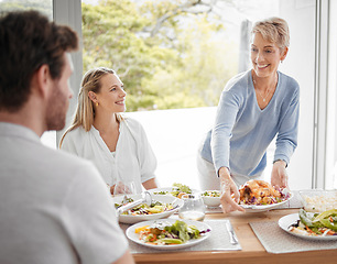 Image showing Family, lunch and food for dining, meal and happy at table for celebration event, eating and happiness together. Hosting, family home and thanksgiving feast with cheerful people sharing and fresh