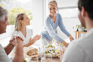 Image showing Thanksgiving, dinner and woman serving food to family for festive celebration meal, lunch and feast. Love, happiness and big family enjoying holiday, vacation and festival tradition in family home